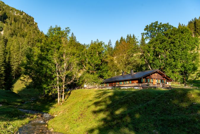 Alpine scenery with a log cabin in the Bavarian Alps, on a sunny day in summer
