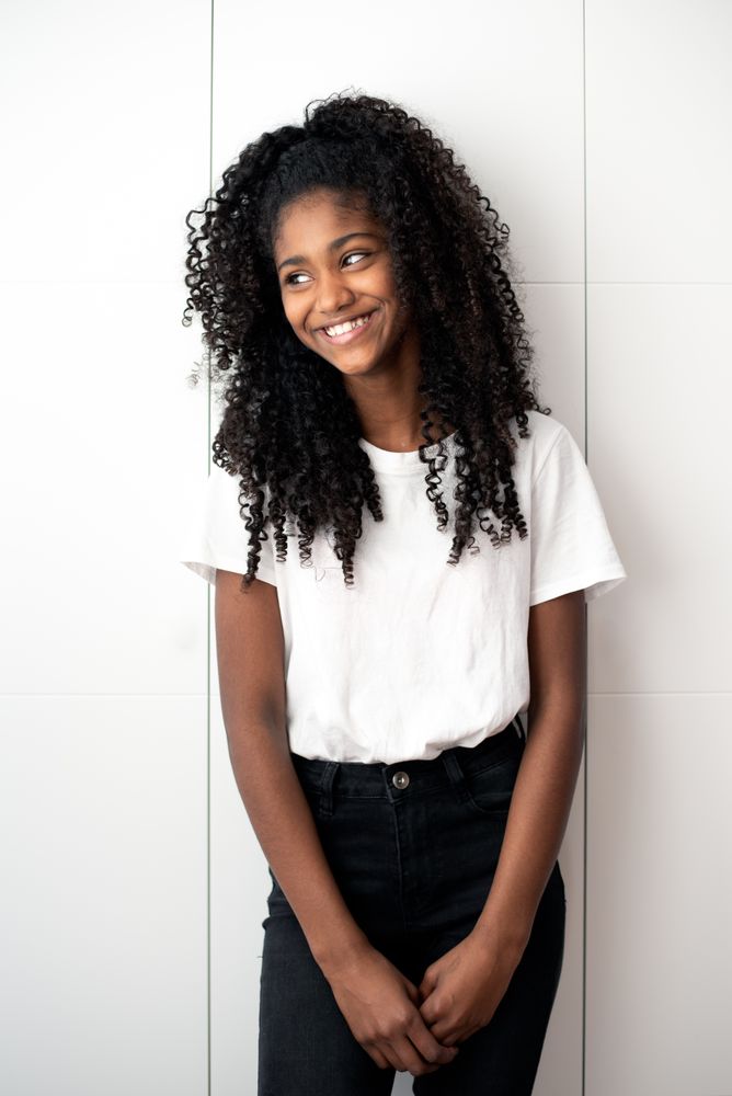 Portrait of a beautiful young Black teenage girl looking into camera