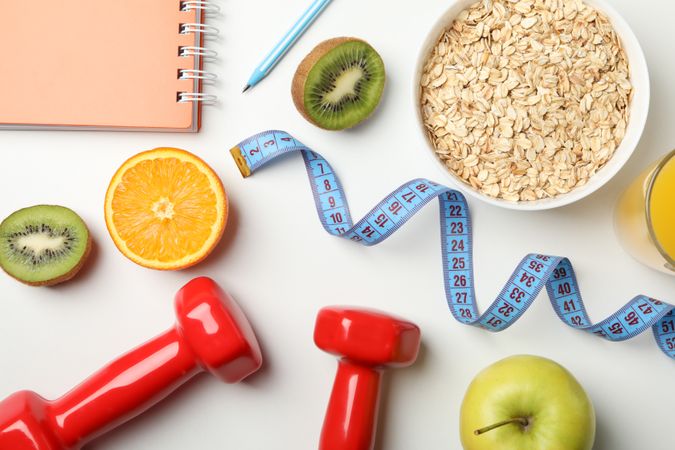 Weight loss accessories on blank background, top view