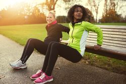 Healthy women exercising outdoors in a park in the morning
