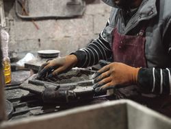 Crop artisan working with dry cement