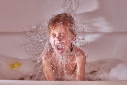 Boy taking bath and yelling