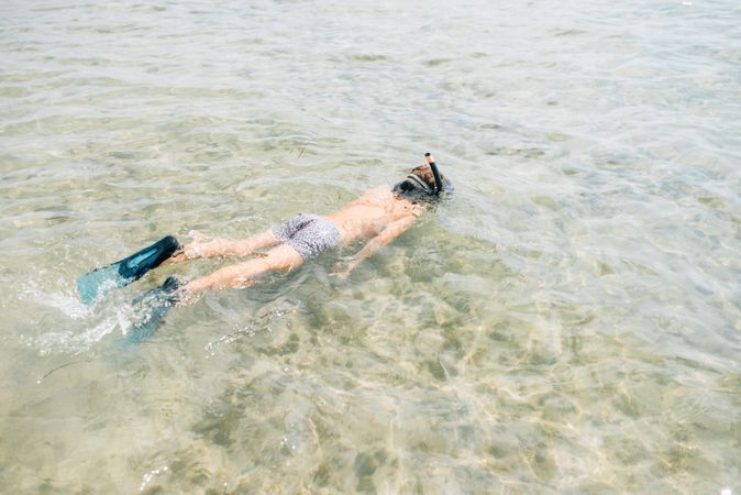 Kid swimming in diving mask
