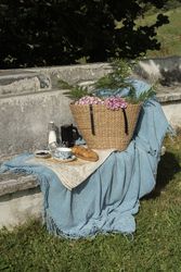 Delicious breakfast with tea and sweets on bench at garden