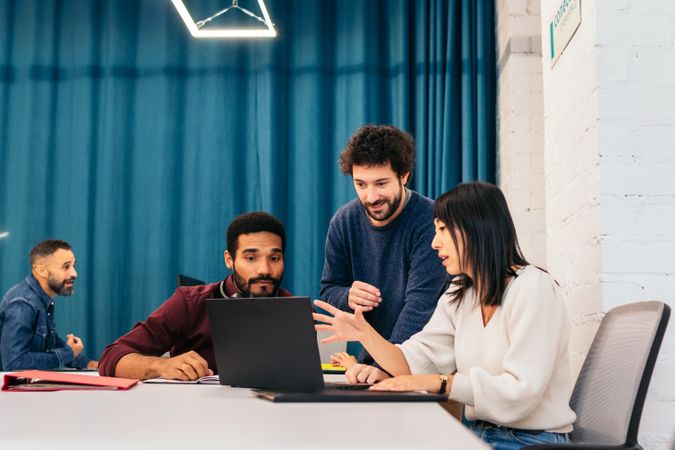 Group of multiracial people working with laptop in a coworking
