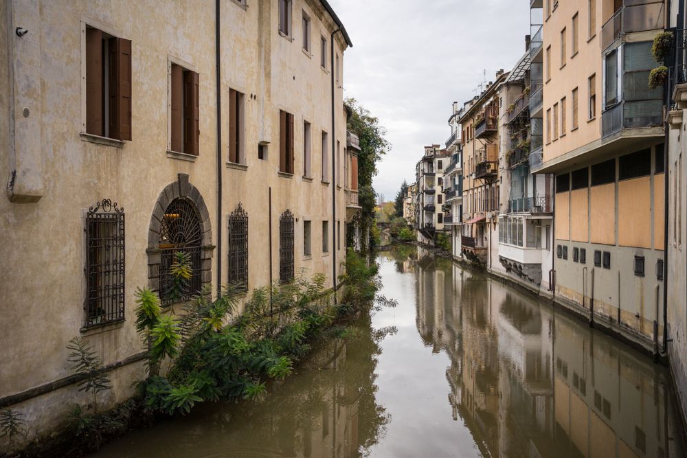 Flooded ancient street among old buildings
