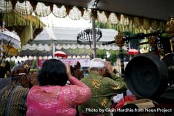 Backs of Indonesian people in Hindu prayer 419lD4
