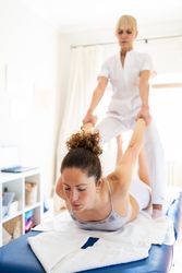 Client having shoulder fixed during rehabilitation session
