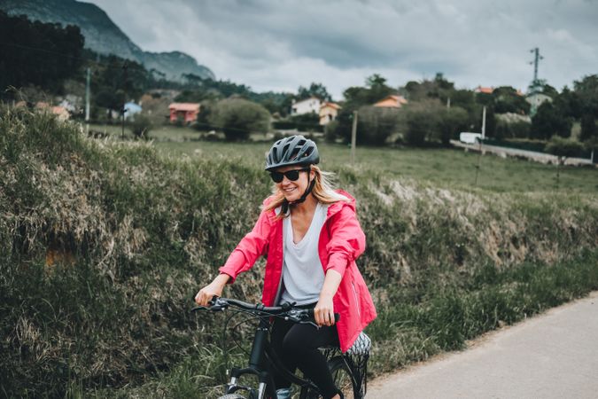 Smiling female riding bicycle