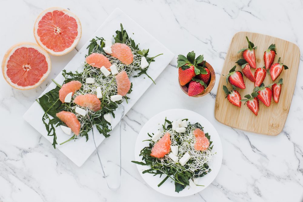 Strawberry, grapefruit and rocket salad on bowl
