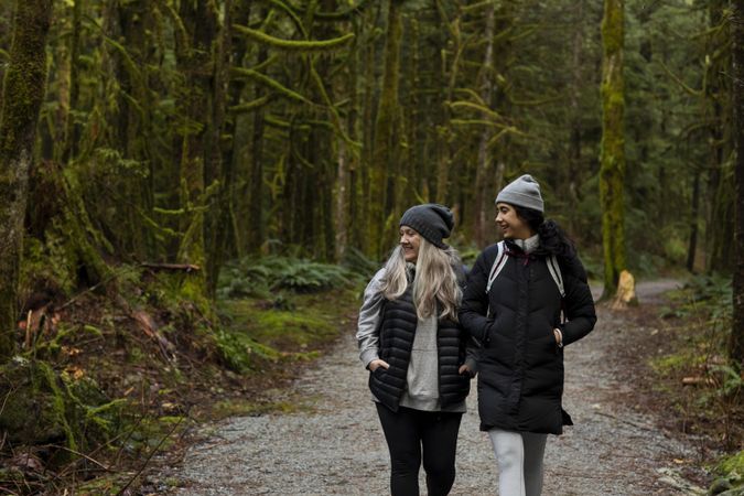 Happy woman and young female explore the outdoors