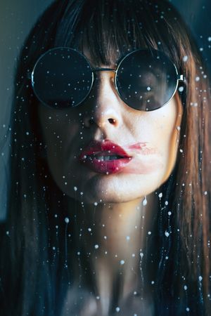 Stylish woman kissing glass