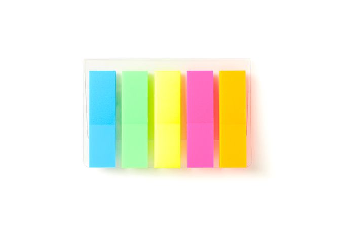 Color stickers in transparent packaging isolated on studio background