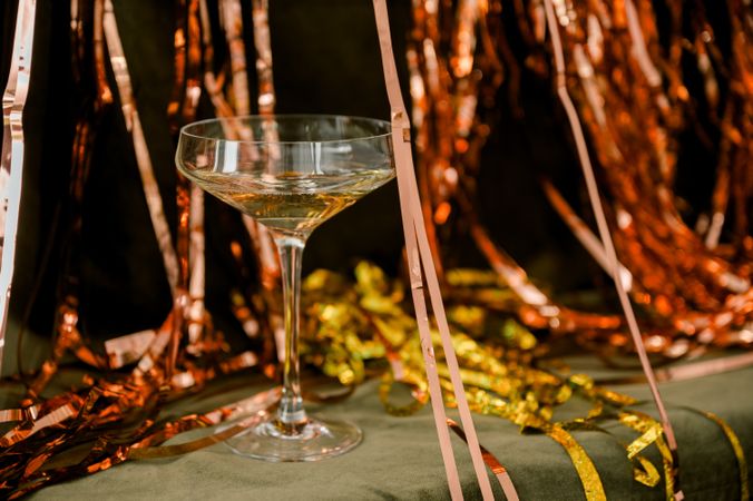 Champagne for new year greetings green and gold background