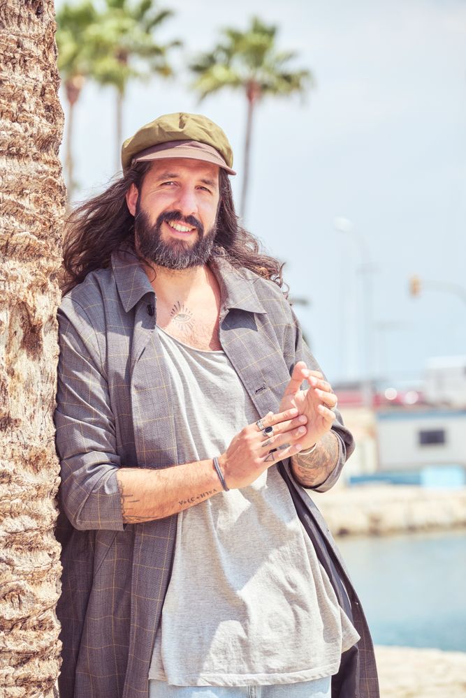 Smiling adult man near pier