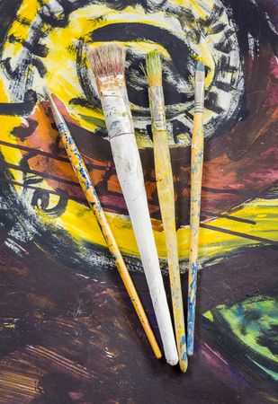 Set of paint brushes on oil painting
