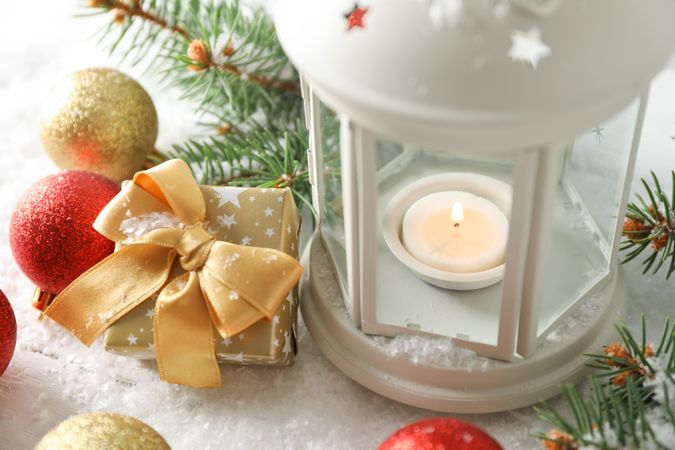 Christmas lantern on decorated background, close up