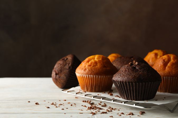 Composition with tasty muffins on wooden background