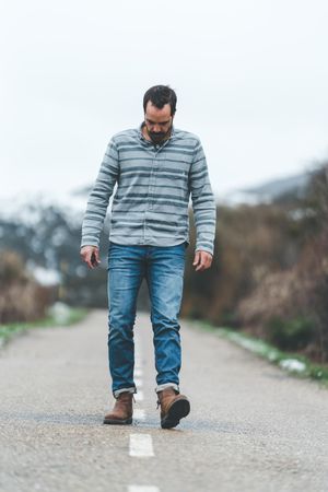 Man walking on country road