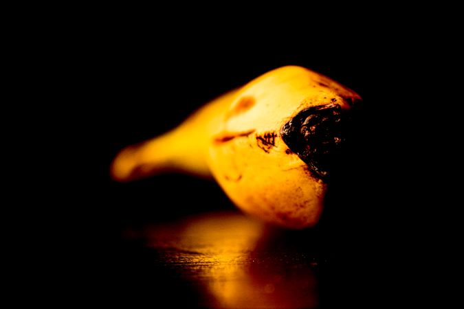 Banana resting in dark room