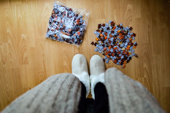 Woman standing in front of puzzle pack