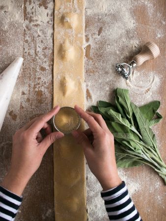 Sorrel and kitchenware near raviolis