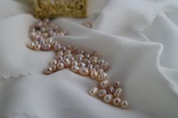 Close up of freshwater cultured pearls on satin silk