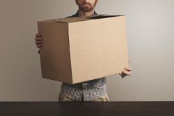 Man holding cardboard box