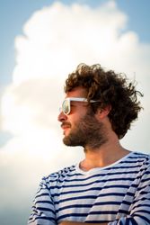 Man looking away in turquoise sea