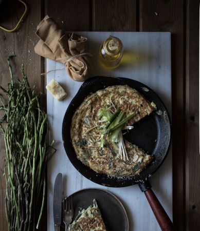 Tortilla with fresh green in skillet pan