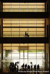 Silhouette of people in a building 5QYgV5