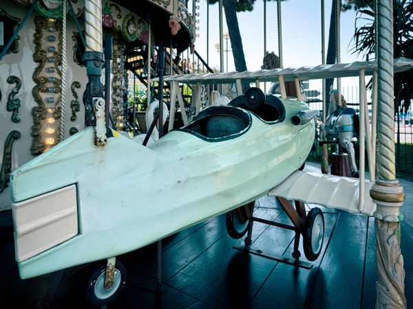 rear view of biplane: Carousel 1900