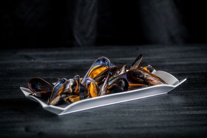 Steamed mussels with Thai sauce in plate