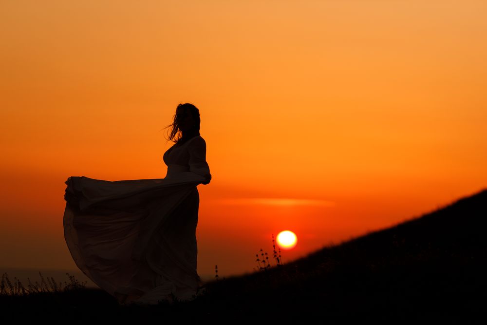 Bride In Wedding Dress Sunset