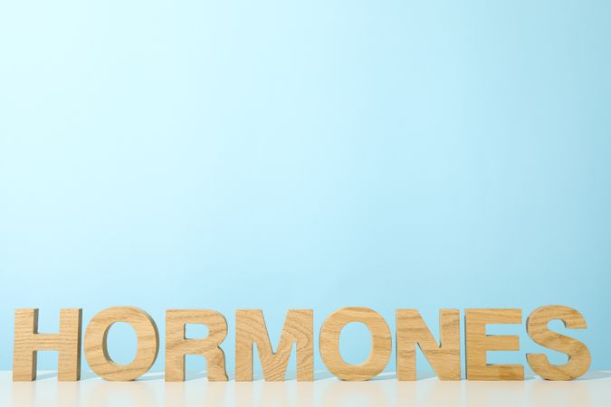 The word hormones on a light background.