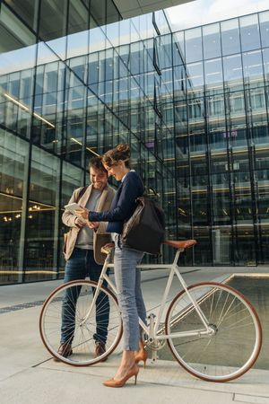Businesspeople talking on street after work