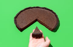 Chocolate tart isolated on a green background