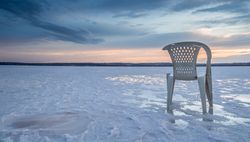 Chair on salt mine during sunset