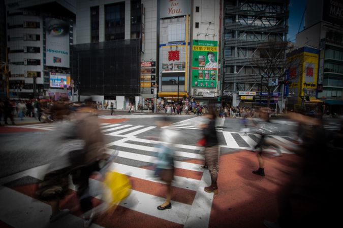 Long shot of people walking on pedestrian lane in Japan