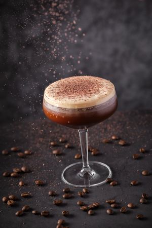 Espresso martini cocktail decorated with grated chocolate placed