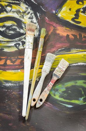 Set of paint brushes on oil painting