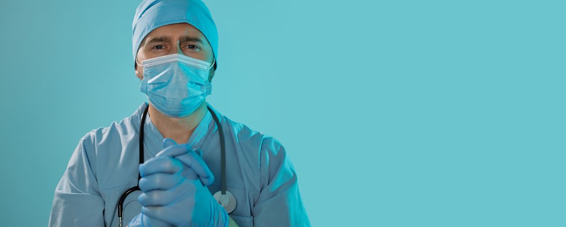 Doctor With Folded Hands Symbolizing Trust and Care