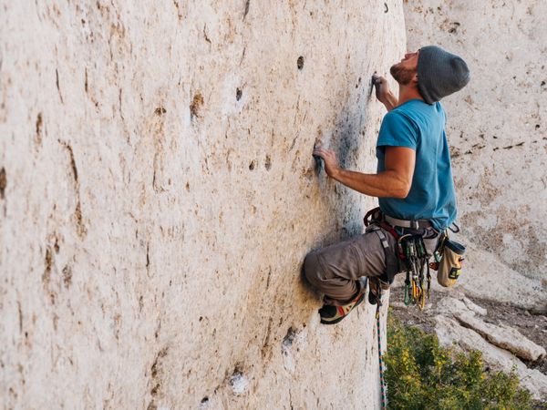 Person climbing a rock mountain
