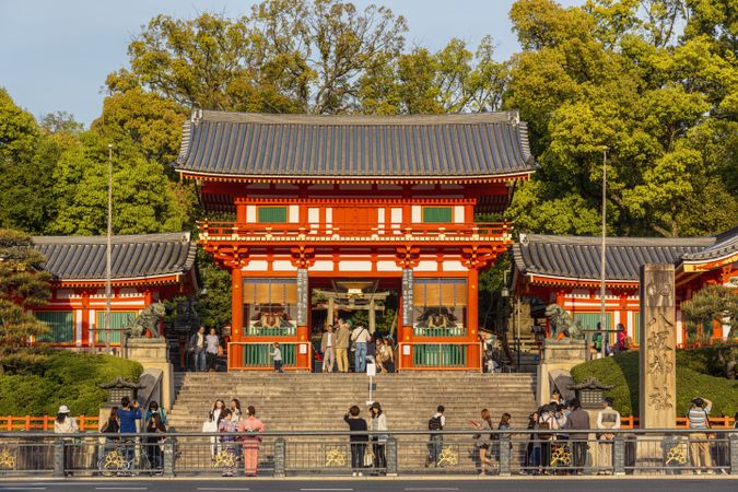 People walking at the exterior of Yasaka Shrine in Kyoto, Japan