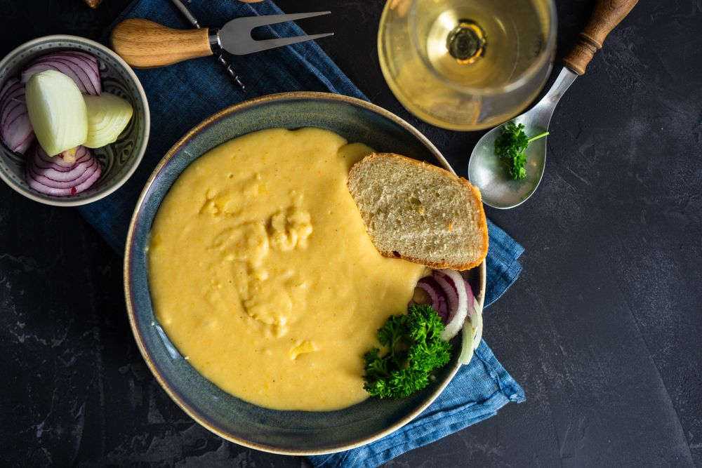 Top view French onion cream soup served with wine