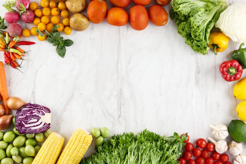 Marble background with Fresh Vegetable Frame