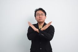 Asian Businessman gesturing stop