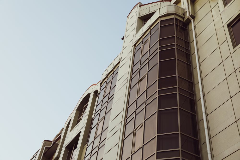 Beautiful building against blue sky, space for text