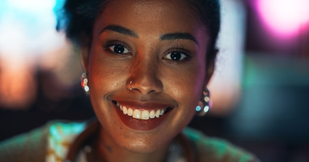 Close Up Portrait of Black Stylish Woman with Curly Hair and Black Eyes.