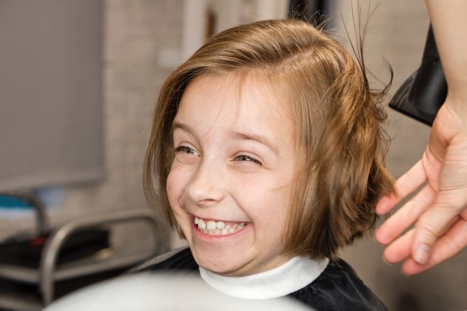 Smiling Child Modeling a Bob Haircut